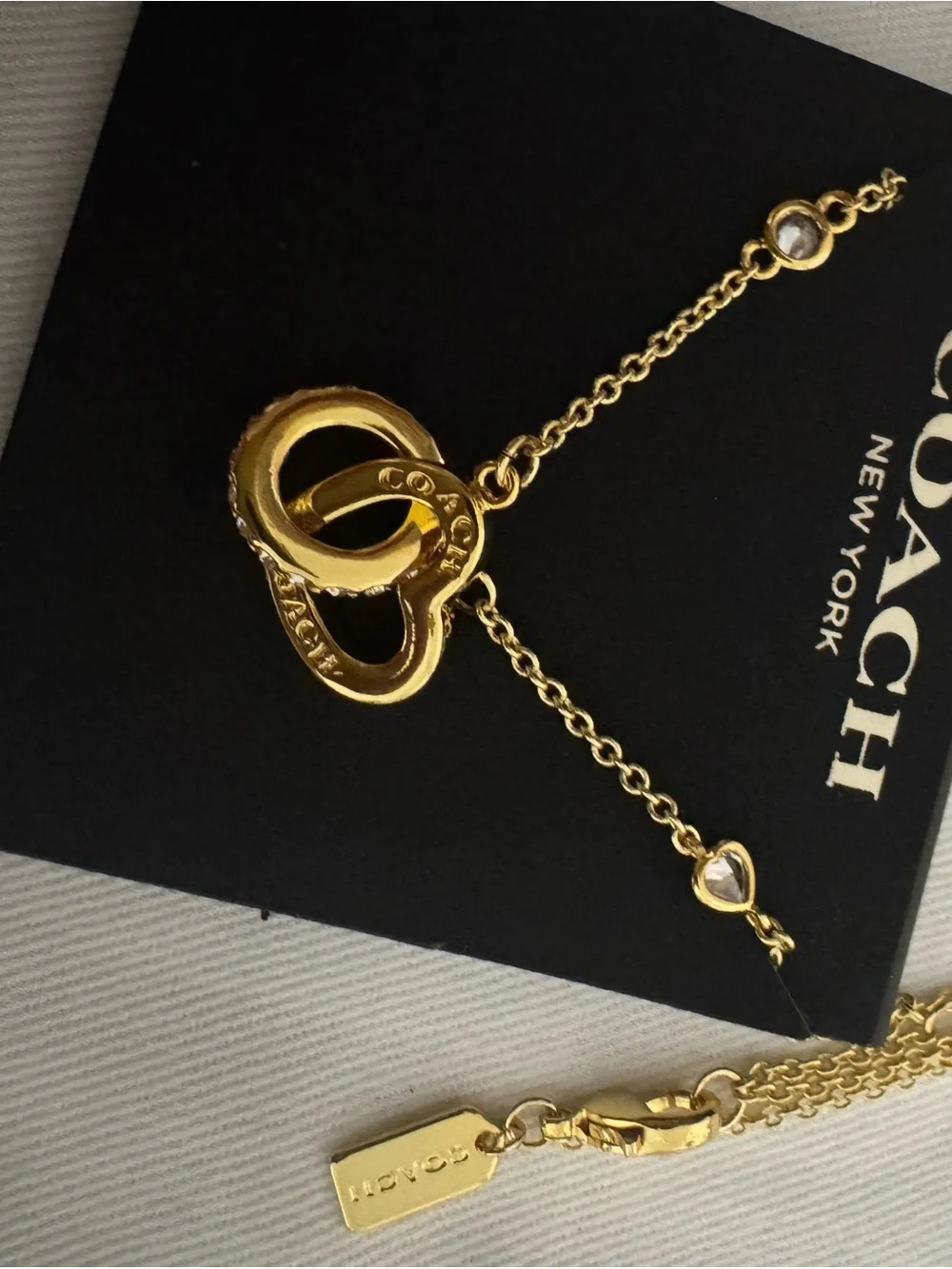 Coach Gold Interlocking Heart Necklace with Crystal Accents